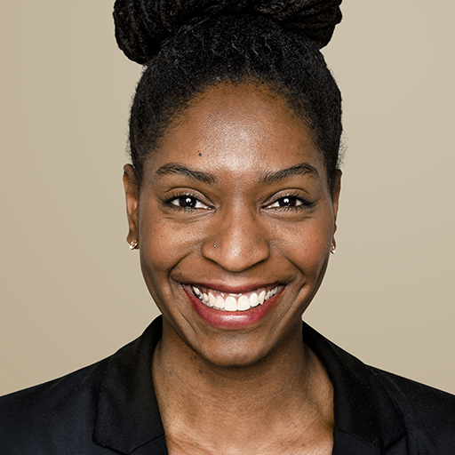 African-American woman smiling on beige background